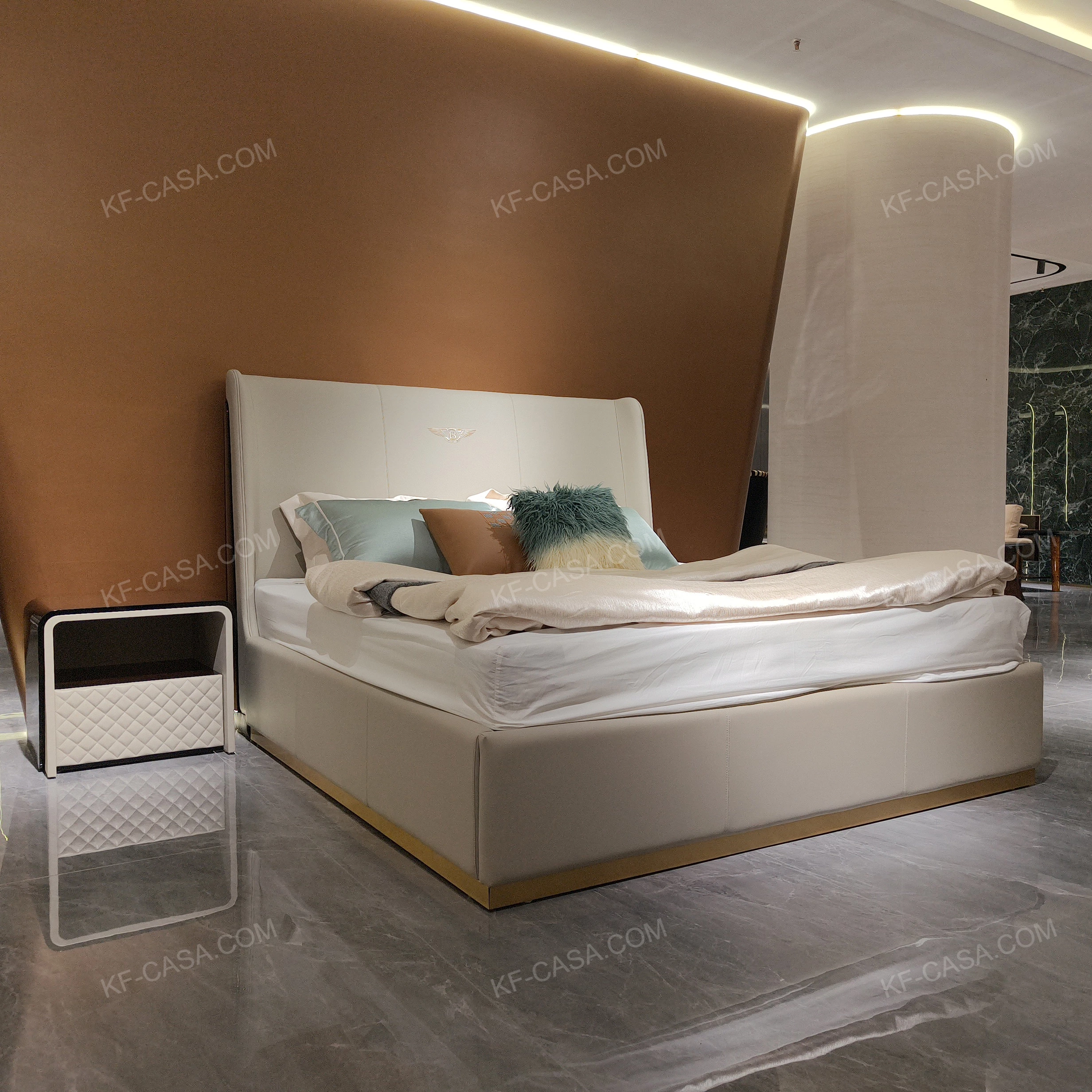 Light Beige Upholstered Bed with Brand Emblem & Gold Stainless Steel Base